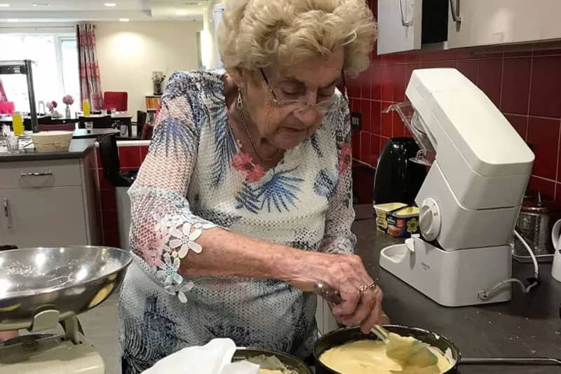 Resident baking a cake