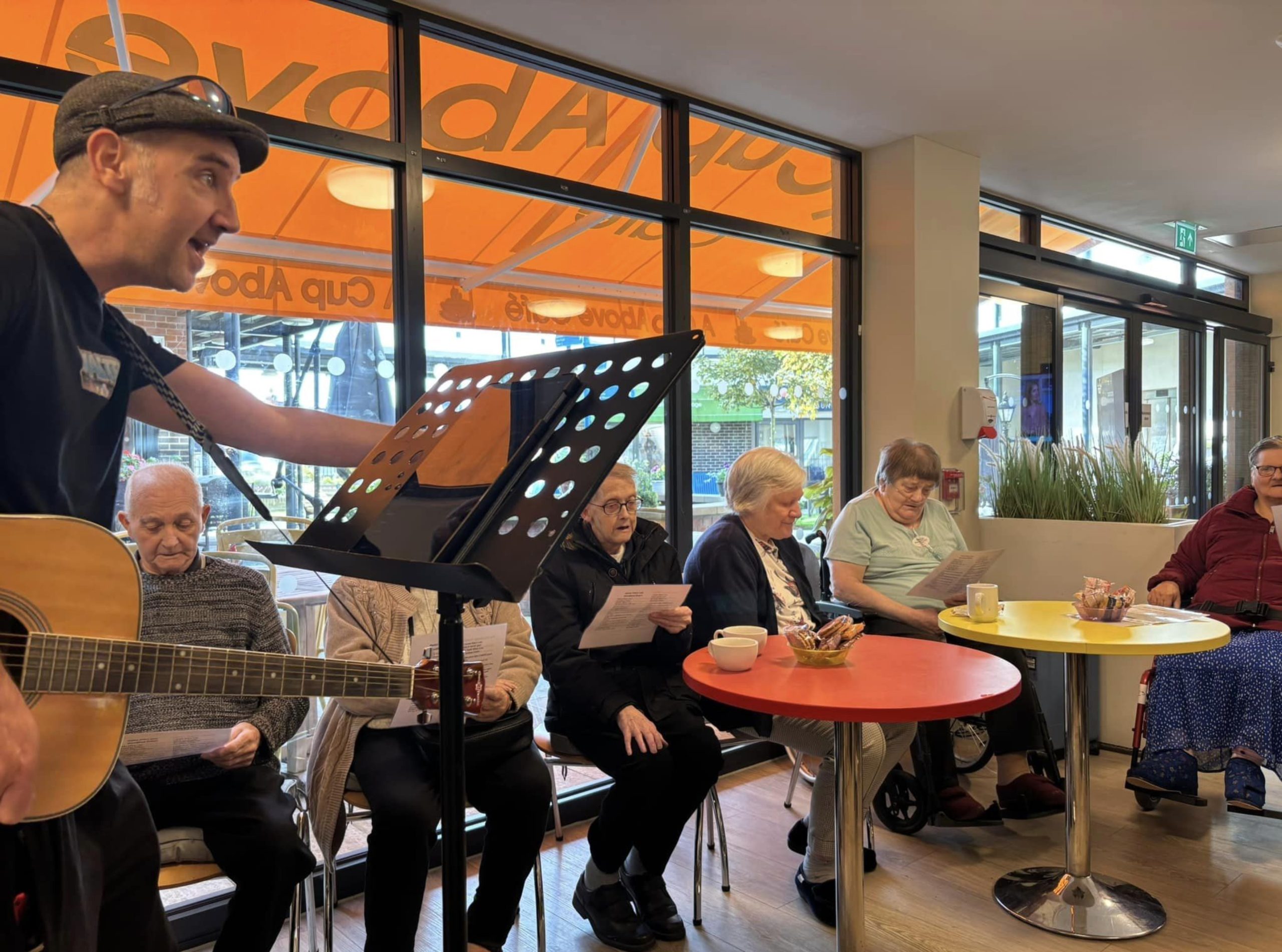 Elderly people playing music at a cafe